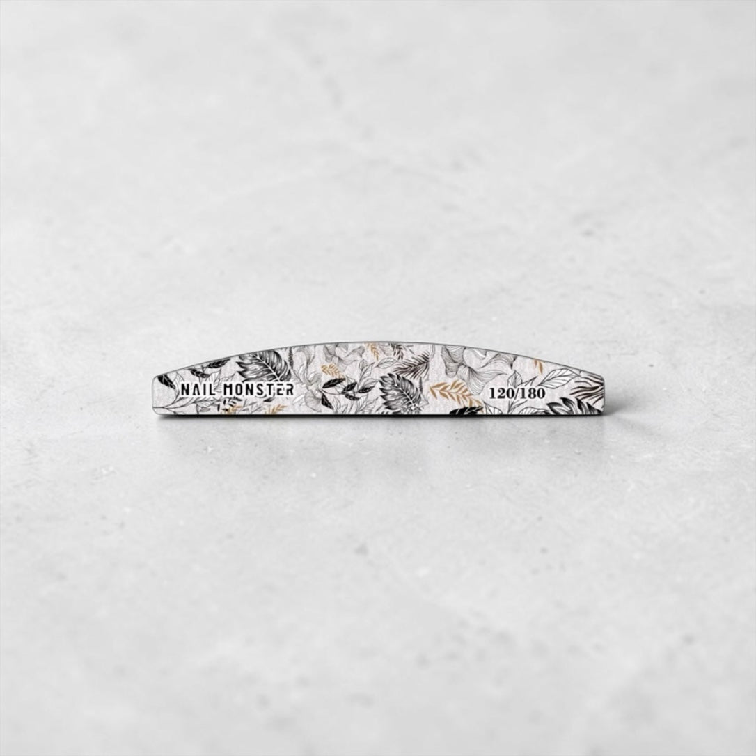 Nail Monsters professional curved nail file with a black and white botanical print and 120/180 grit dual-sided design.