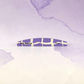 Nail Monsters professional curved nail file with a purple and cream abstract pattern and 120/180 grit texture.
