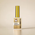 Nail Monsters Golden Platinum gel polish in a 15ml bottle with a metallic gold cap and glittery gold finish.