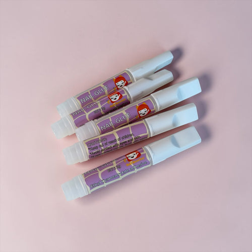 Nail Monsters professional adhesive nail glue pens with precision applicators for long-lasting press-on nail application.
